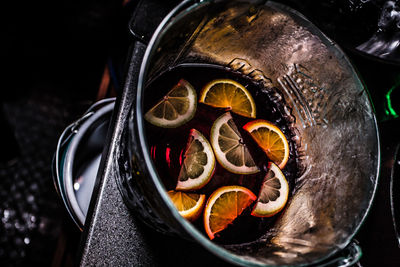 High angle view of fruits in bowl on table - sangria