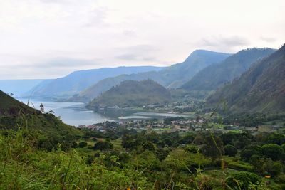 Scenic view of landscape and mountains against sky