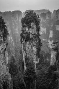 View of rock formation on mountain against sky