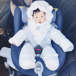 High angle portrait of cute boy in car