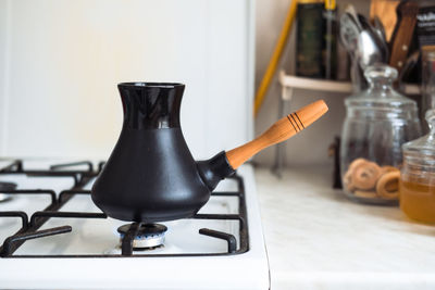 Turk on a gas stove, close-up