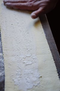 High angle view of person preparing food on table