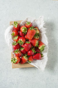 High angle view of strawberries on table against white background