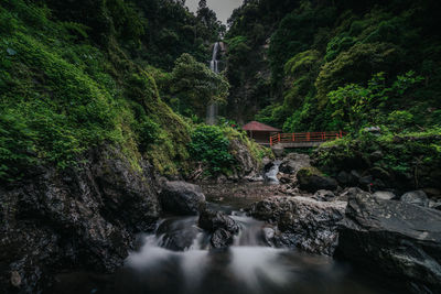 View of waterfall along rocks