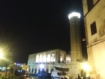 Low angle view of illuminated building at night