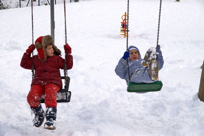 Panoramic view of swing in winter