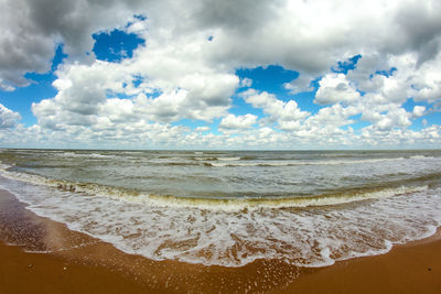 Scenic view of beach against sky