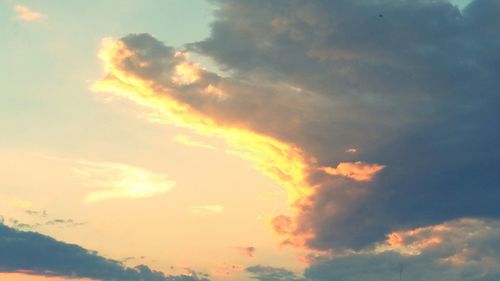 Low angle view of cloudy sky at sunset