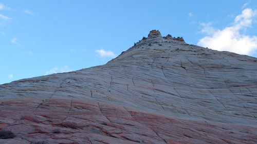 Low angle view of rock formations against sky