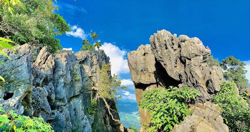 Low angle view of rock formation against sky