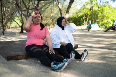 Side view of woman exercising in park