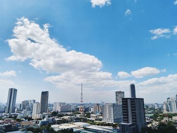 Modern buildings in city against sky