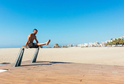 Sportsman practicing stretching and calisthenics