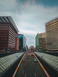 City street amidst buildings against sky