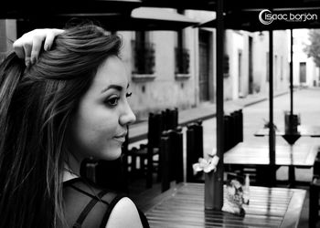 Woman looking at camera in city