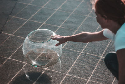 Side view of man playing with bubbles in water