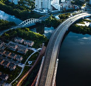 High angle view of bridge over river amidst buildings in city