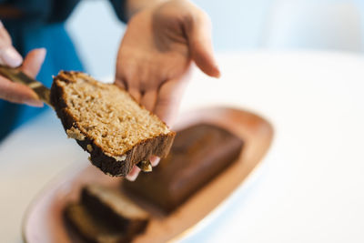 Woman cuts healthy banana bread