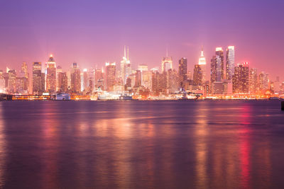 Illuminated buildings in city at night