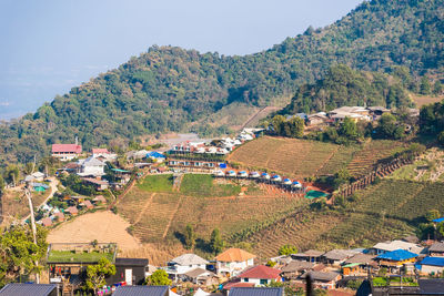 High angle view of houses and trees against sky