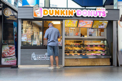 Man standing on display at store