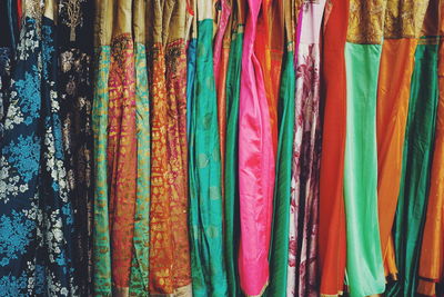 Full frame shot of dresses hanging in store