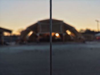 Close-up of illuminated street light against sky at sunset