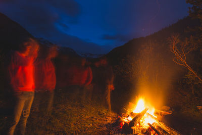 Close-up of bonfire against sky at night