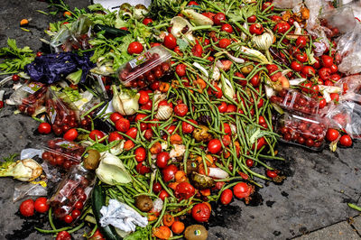 High angle view of rotten vegetables on footpath