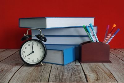 Close-up of clock on table