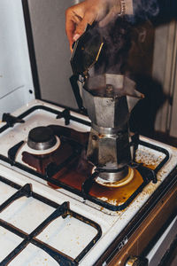 Man holding coffee cup at home