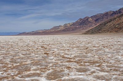 Salt flats in a desert basin in badwater basin in death valley national park in california