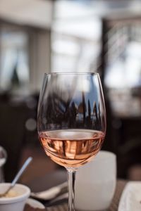 Close-up of wine in glass on table