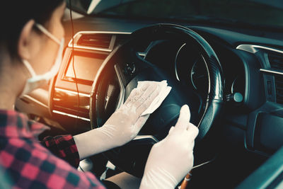 Close-up of hand holding car