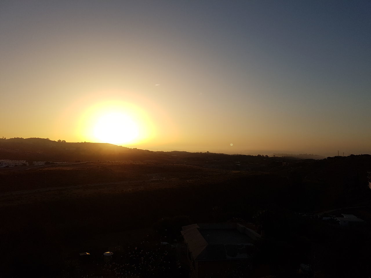 VIEW OF SILHOUETTE LANDSCAPE AGAINST SUNSET