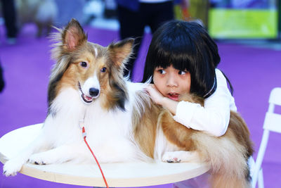 A little girl and a collie