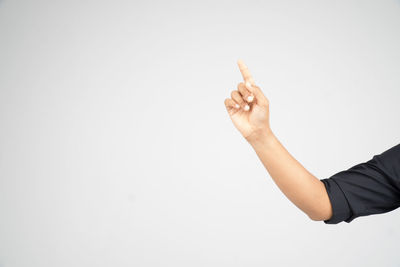 Close-up of human hand over white background