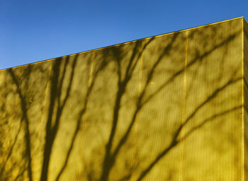 Low angle view of building against blue sky