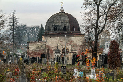 View of cemetery against built structure