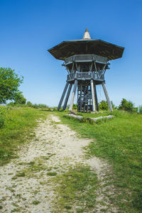 Gazebo on field against clear sky