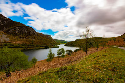 Scenic view of lake and mountains against sky