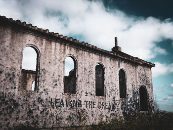 Low angle view of old building against sky