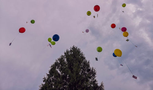 Low angle view of balloons in sky