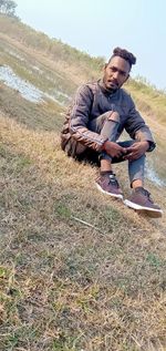 Portrait of young man on land