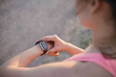 Midsection of woman using mobile phone