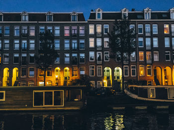 View of buildings in city at night