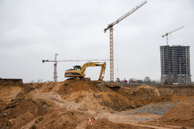 Excavator during earthworks at construction site. backhoe digging the ground for the foundation 