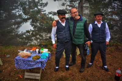 Men and vegetables on table