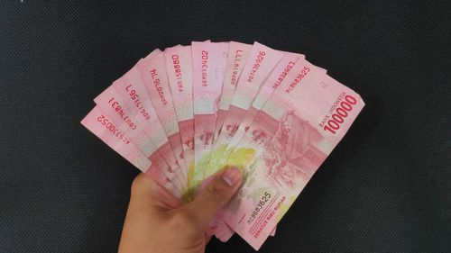 Midsection of person holding umbrella