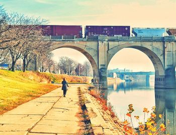 Man walking on footbridge